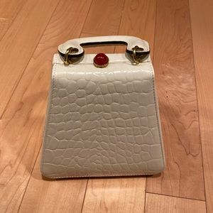 STAUD. Small triangle mini bag.